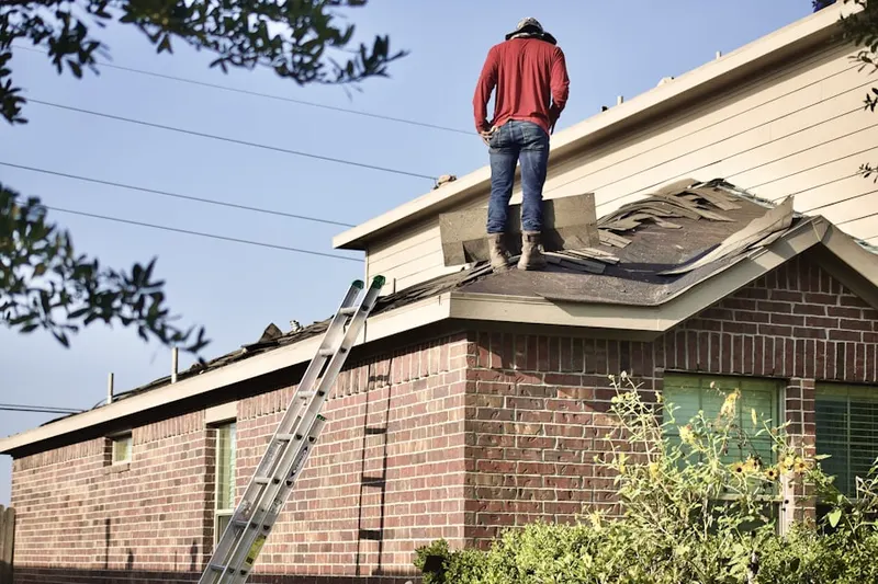 Professional roofer working on a residential roof in Lake Biltmore Village